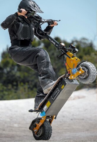 Rider performing a wheelie on the fastest e scooter Yume X11, built for extreme off-road power and durability.