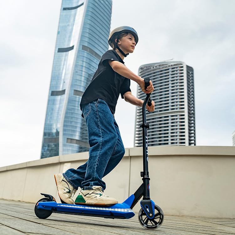 Young boy riding an Aero G6 electric scooter in an urban setting, wearing a helmet, featuring a lightweight design with LED lights for style and safety.