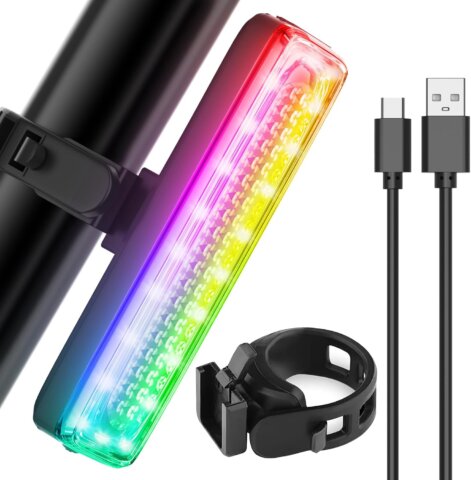 A close-up of a multicolor rechargeable LED light bar with mounting bracket and USB charging cable for bikes and scooters.